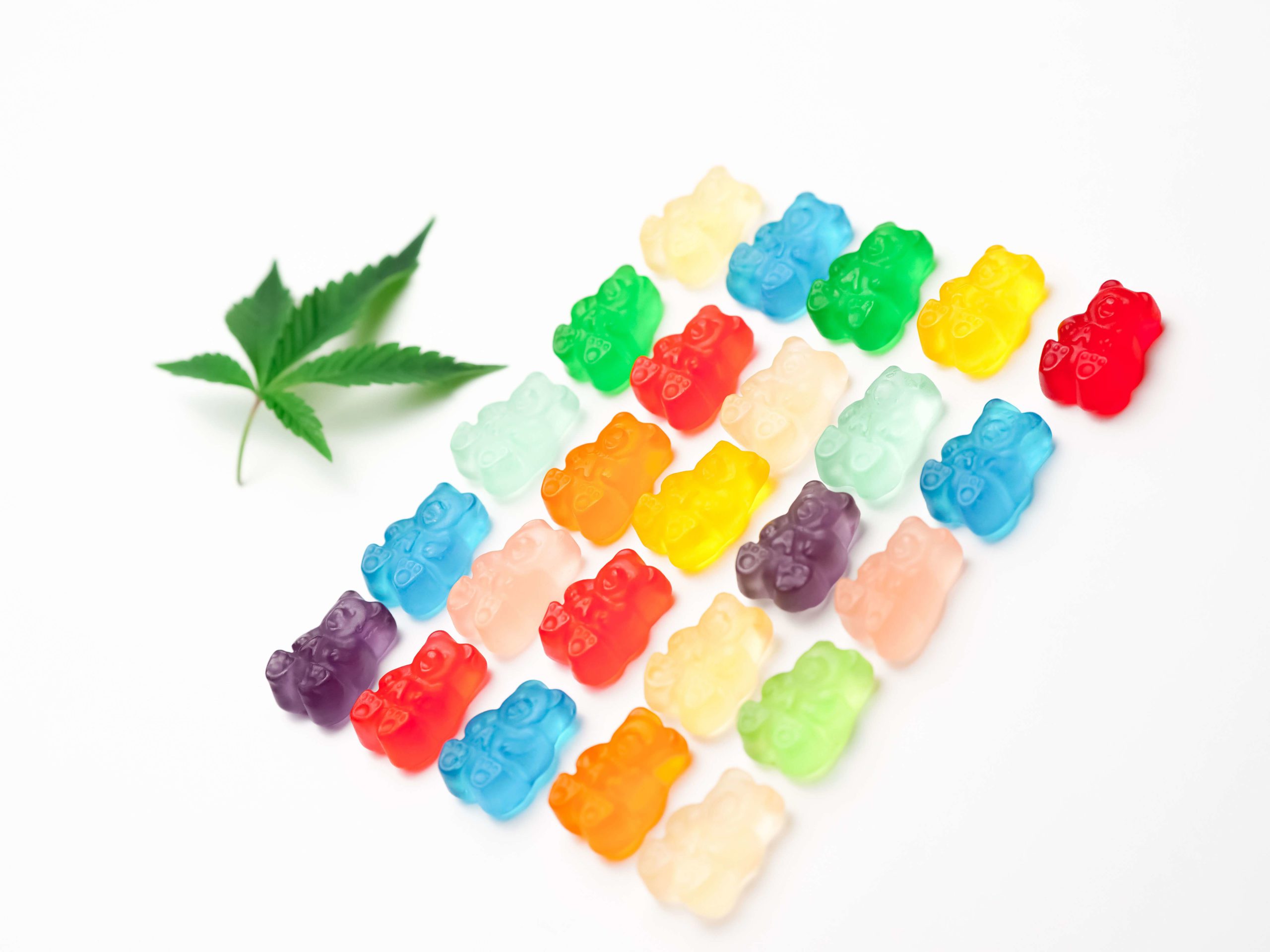 cannabis gummies and a marijuana leaf