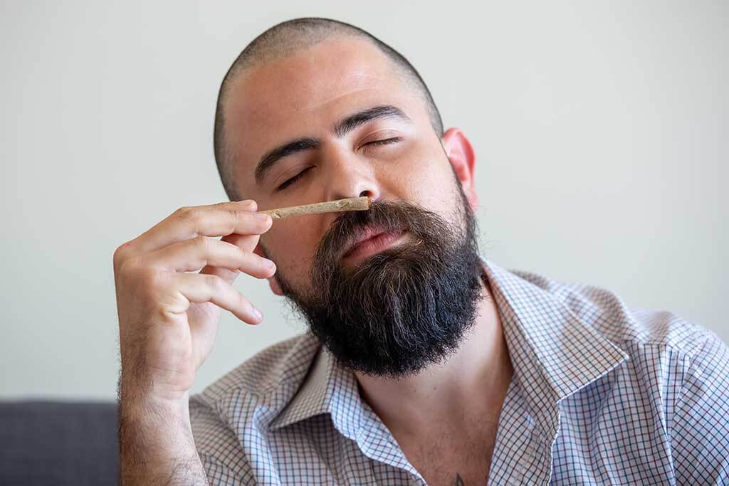 Man smelling the terpenes in a joint